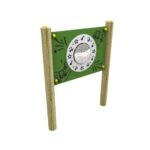 A green outdoor musical play panel with wooden posts, a central silver drum, and black musical note decorations.