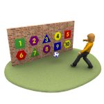 A person is kicking a soccer ball toward a vibrant sports panel, adorned with colorful shapes numbered 1 to 10 on the brick wall.