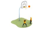 Two children on grass play basketball; one shoots the ball towards the hoop whilst the other stands with arms raised beneath the net.