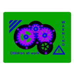 A green sign with gears, the text “Children at work,” “Warning,” and a caution symbol. The gears are purple and blue with a black outline.