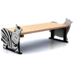 A wooden bench with legs shaped like cartoon animals, one decorated as a zebra and the other as a cow.