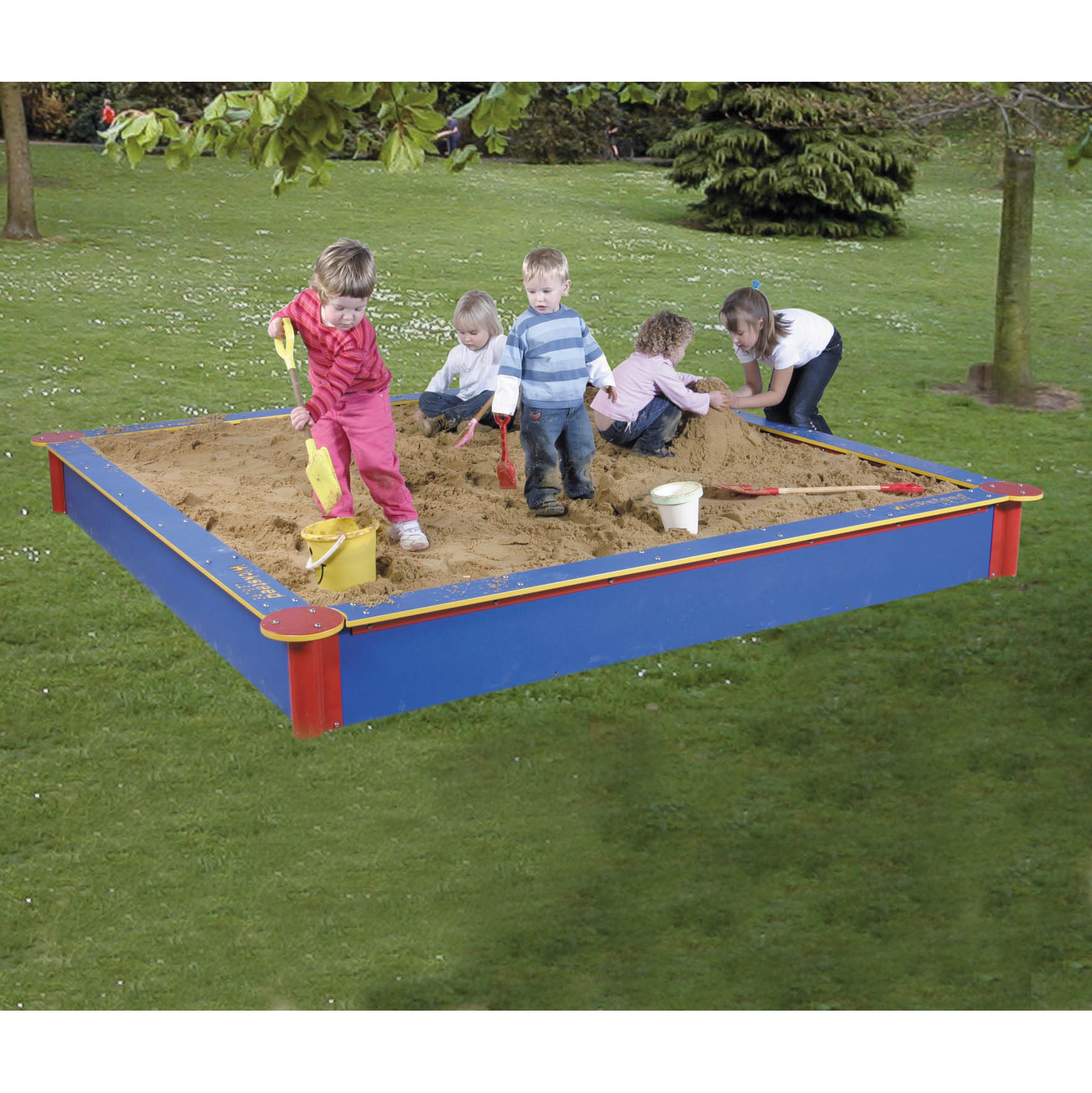 Children playing in large sandbox