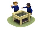 water table with grass and children