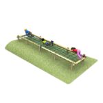 Three children climb across a 6m Embankment Scramble Net, a horizontal rope structure built over a grassy mound and supported by sturdy wooden posts.