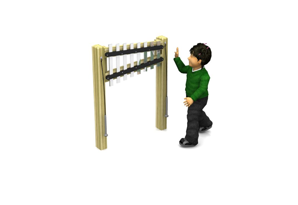A child in a green jumper raises a hand towards an outdoor musical instrument with metal bars mounted on two wooden posts.