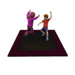 Two children, one in pink and one in red, are playing on a square trampoline with a dark frame against a white background.
