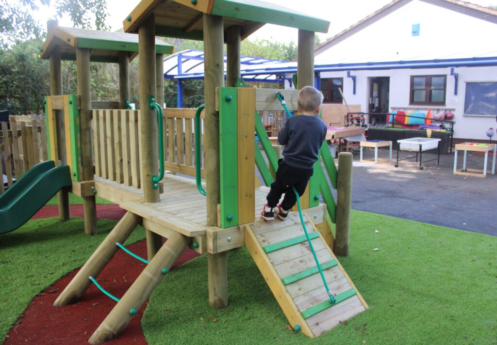 child climbing the rope climber ramp on Marco Polo