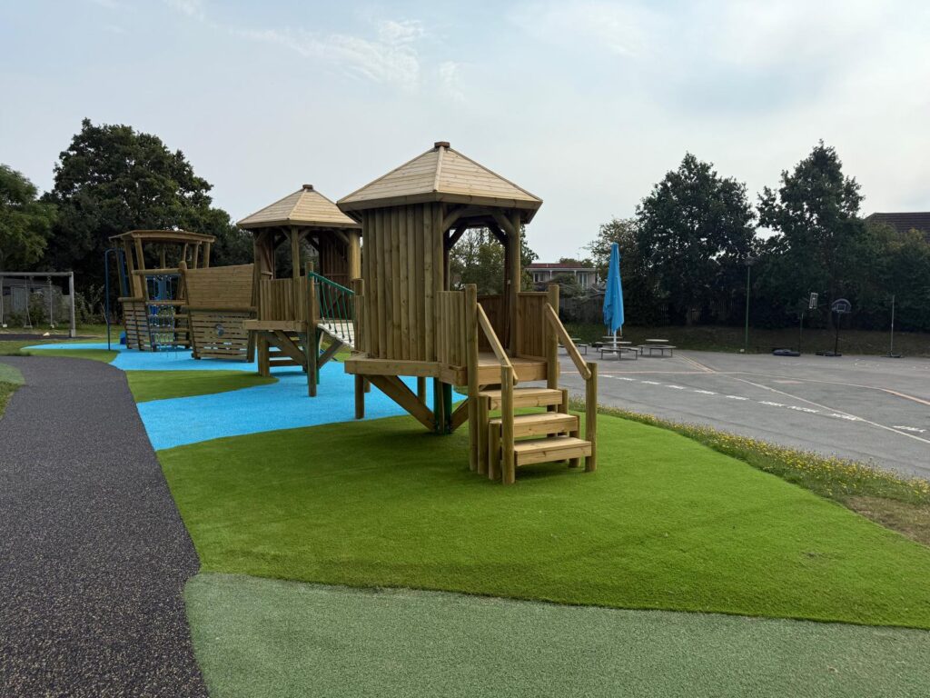 Play equipment with blue surfacing to replicate water