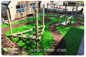 School playground ideas for small spaces at Almeley Primary featuring low-level trim trails and balance equipment by Fawns.