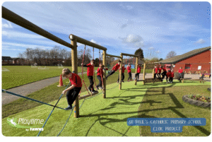 Children in red jumpers from St Paul’s Catholic Primary School outdoor play equipment, trim trail from Playtime by Fawns 
