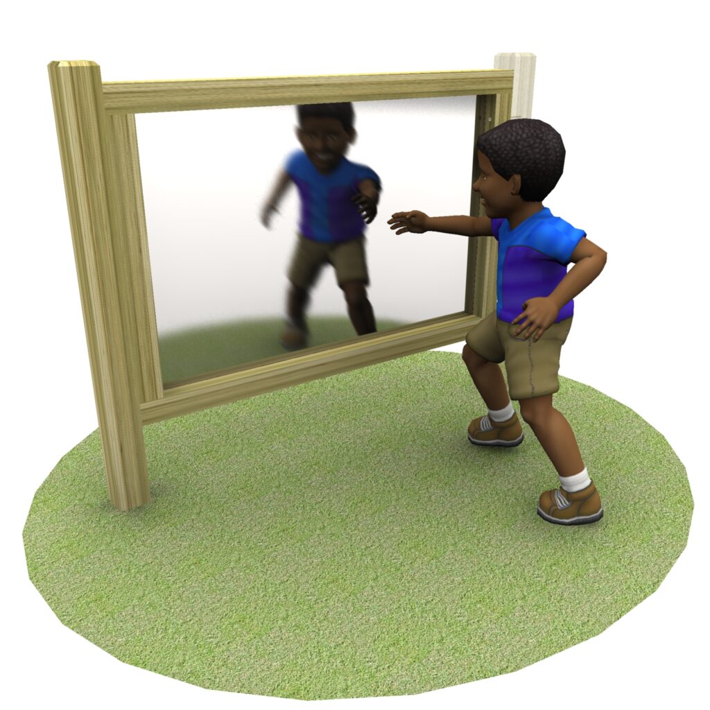 A child stands on grass, reaching towards their reflection in a large Adjoining Mark Making Mirror framed with wood.
