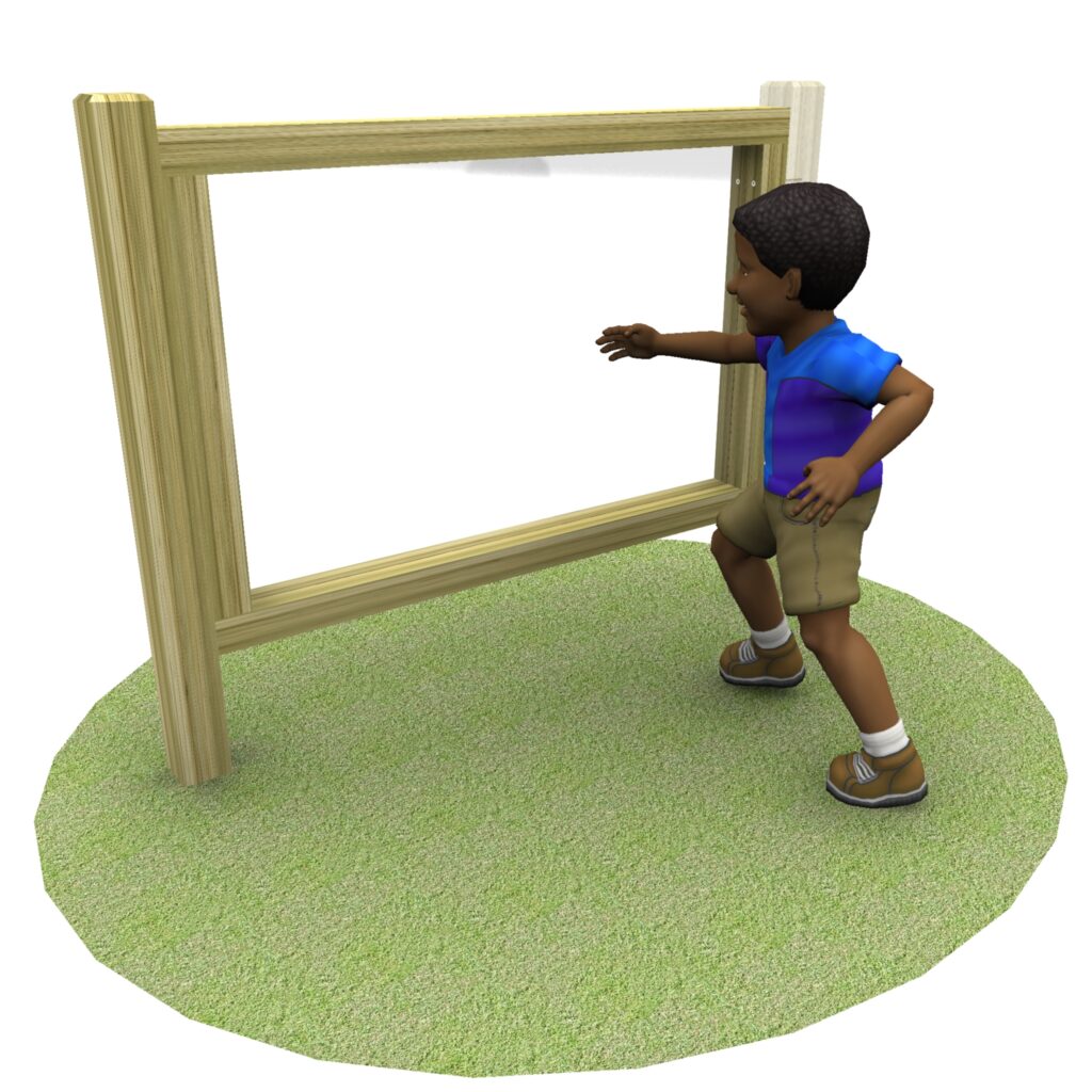 A child stands on grass and reaches towards a large wooden outdoor frame with a clear panel, exploring creativity on the Adjoining Mark Making Paint Board.