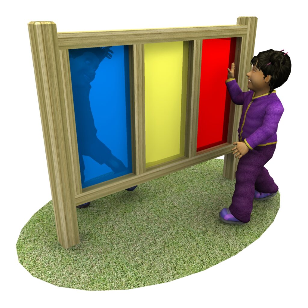 A child in purple pyjamas touches a wooden panel with blue, yellow, and red acrylic windows, standing on grass.