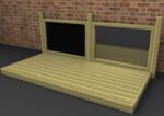 A wooden platform with two rectangular frames against a brick wall, one frame filled with a black panel and the other with a mesh panel.