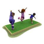 Three children are jumping and balancing on a raised grassy platform, each with one leg lifted in the air.
