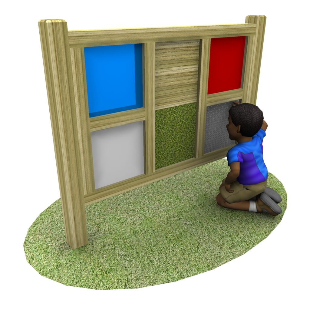 A child kneels on grass, interacting with a sensory panel that has coloured and textured squares framed in wood.